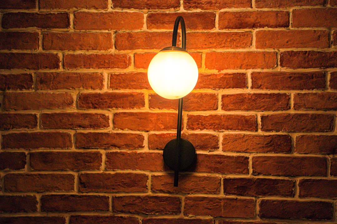 a-light-that-is-on-a-brick-wall-mamjrghfdew